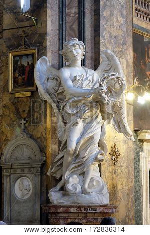 ROME, ITALY - SEPTEMBER 03: Statue of the Angel with the scroll by Bernini in Basilica di Sant Andrea delle Fratte, Rome, Italy on September 03, 2016.