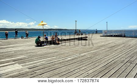 Tathra Australia - Jan 6 2017. Tathra Steamer Wharf. Its historic timbers standing proud and creating a focus for visitors. It is the only remaining sea wharf on the East Coast.