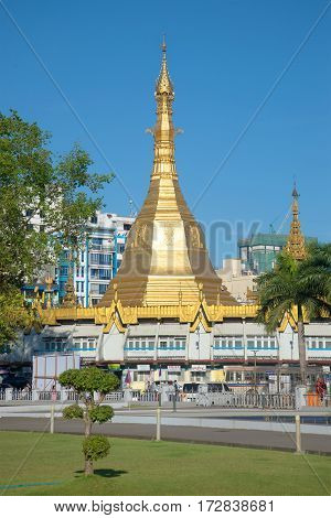 YANGON, MYANMAR - DECEMBER 18, 2016: A view of Sule pagoda from the city park in the sunny day