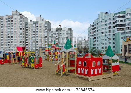GOMEL BELARUS - APRIL 14 2016: Modern children's playground with bright colorful constructions in sleeping district on street Khatayevich Gomel Belarus