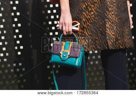 MILAN ITALY - FEBRUARY 22: Detail of bag outside Gucci fashion show building during Milan Women's Fashion Week on FEBRUARY 22 2017 in Milan.