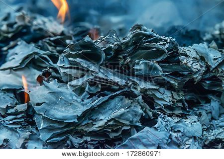 Burnig paper pages and remaining ashes and ember