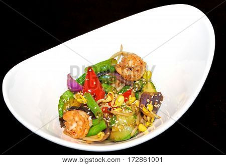 Tiger prawns vegetables Chinese mushrooms and beansprouts in oyster sauce. Dish with shrimps and vegetables. Asian food.