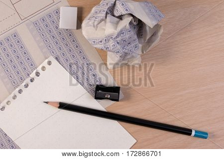 Crumpled Paper Ball Of Vintage Classic Answer Sheet With Pencil, Sharpener And Paper Reduction. Cros
