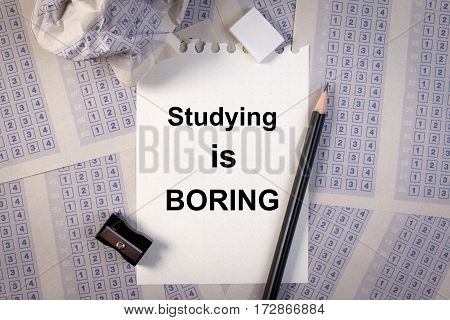 Filling Out In Answer Sheet, Pencil, Sharpener, Paper Reduction And The Word Studying Is Boring.set
