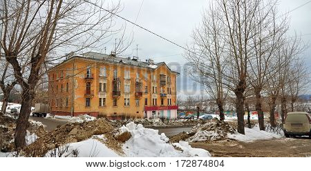NOVOURALSK/ RUSSIA - MARCH 8. Old Stalin-era building on Gorky Street in the city Novouralsk (closed town in Sverdlovsk Oblast Russia) on March 8, 2014.