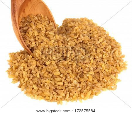 bulgur on a wooden spoon on a white background
