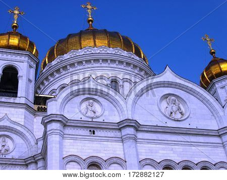 Golden domes of the Cathedral of Christ the Savior against the blue sky. Summer, Moscow, Russia