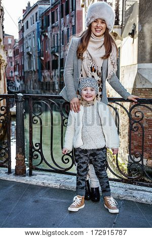 Mother And Daughter Tourists In Venice, Italy In Winter