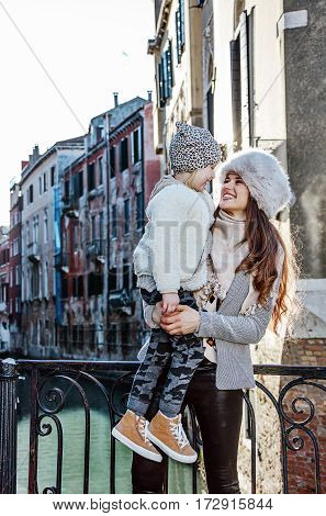 Mother And Daughter Tourists In Venice Looking At Each Other