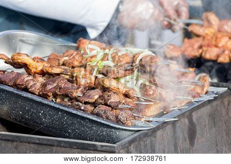 Cooking delicious shish kebab on the grill