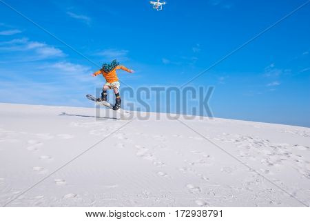 Drone  Shoots A Man Who Does Tricks On A Snowboard