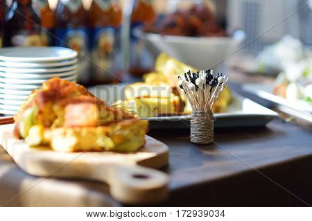 Different Kinds Of Wine Snacks And Variuos Cheeses On White Table