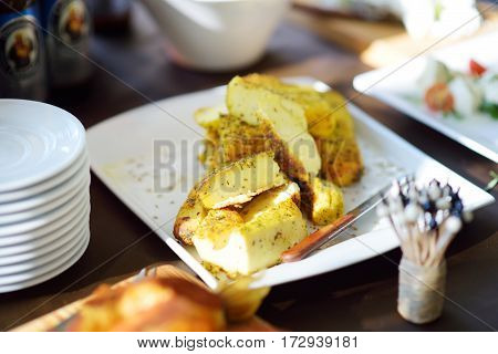 Different Kinds Of Wine Snacks And Variuos Cheeses On White Table