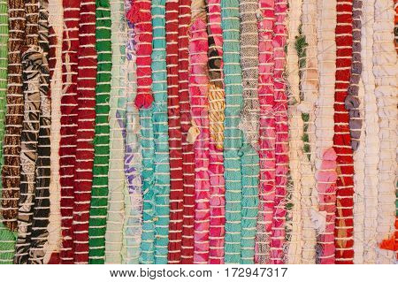 Colorful carpet texture. Background of andalusian carpet. Jarapa. Handmade carpet. Close up of beautiful hand made carpet. Abstract background and texture for designers.