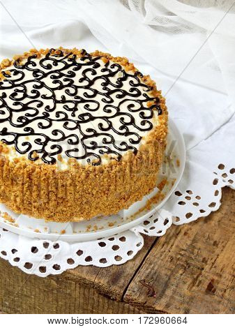 Homemade Cake With Nut Meringue Butter Cream And Decorated With Swirls Of Dark Chocolate. Kyiv Cake