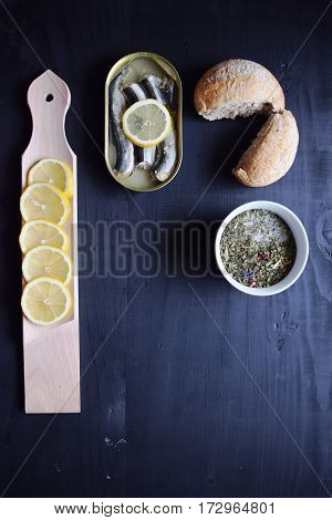 metal can with conserved herring fish, canned marinated herring,  open tin can , Top view.