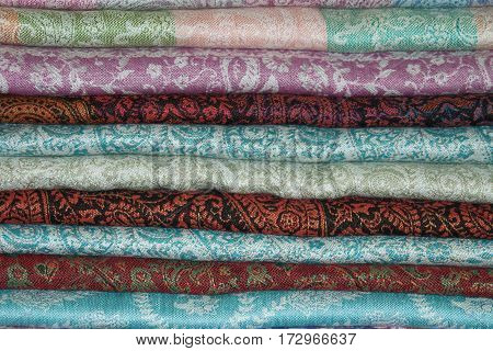 Background from the pile East of cashmere stoles