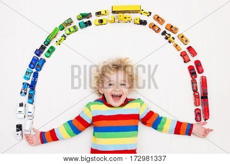 Little Boy Playing With Toy Cars. Toys For Kids.