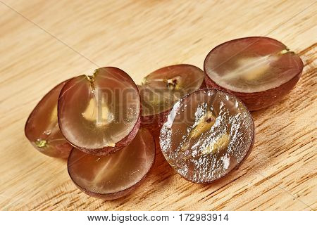 fresh delicious and healthy organic concord grapes on fine wood cutting board