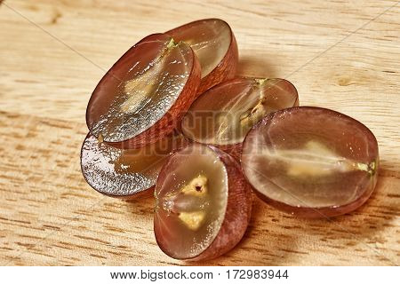 fresh delicious and healthy organic concord grapes on fine wood cutting board