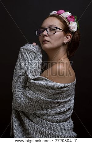 Portrait Of Woman Wearing Eye Glasses And Floral Hand Band While Looking Towards The Camera. Healthy
