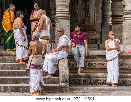 Belur, Karnataka, India - November 2, 2013: Chennakeshava Temple. Group Of Men And Women Wait In Fro