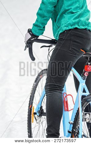 Cyclist On Cyclocross Bike Trails In The Snowy Forest In Winter. Winter Workout Outdoors Concept