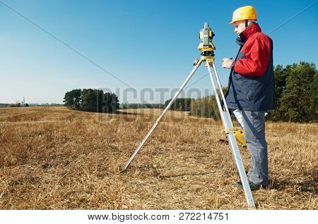 surveyor worker with theodolite