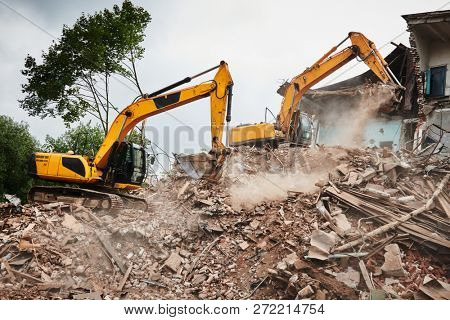 excavator crasher machine at demolition on construction site