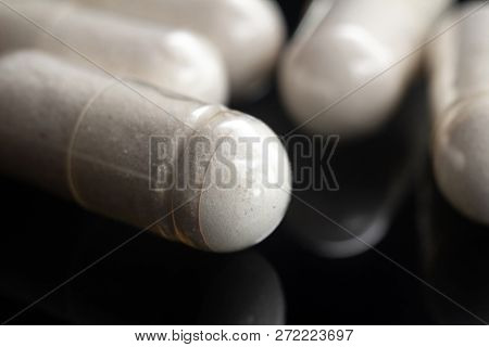 White Medical Capsules Of Glucosamine Chondroitin, Healthy Supplement Pills, Macro Image.