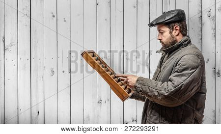 Idea - Old-fashioned Financial Auditor With Old Wooden Abacus, Retro Background. Clipping Path Man