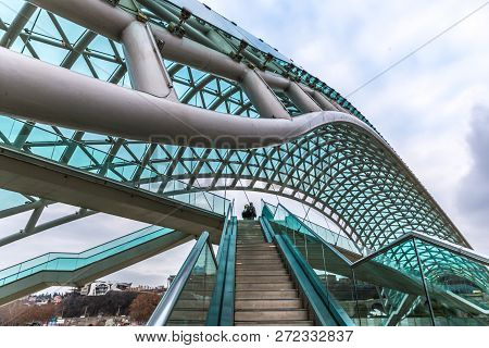 The Modern Peace Of Bridge In Tbilisi In A Cloudy Winter Day In Georgia