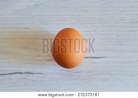Red Egg Close-up On A Wooden Table