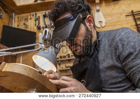 Craftsman Violinmaker Began Working On A New Violin In His Workshop