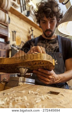Craftsman Violinmaker Began Working On A New Violin In His Workshop
