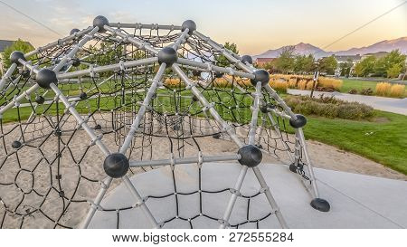 Dome Climber Against Homes Mountain And Sky