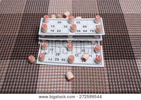 Lotto Game. Wooden Lotto Barrels And Card For A Game In Lotto. Board Game Lotto Or Bingo. Vintage Ga