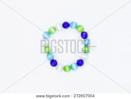 A Strand Of Blue Green And White Multi Faceted Jewelry Beads
