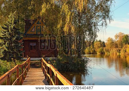 Autumn Morning Landscape With Abandoned House And Trees. Small Island In The Middle Of The Lake. Vil