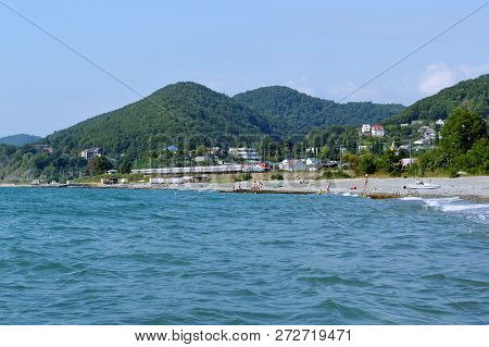 The Beach In Golovinka (lazarevsky District, Sochi). The Train Travels By Rail Along The Black Sea C