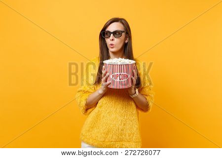 Suspicious Puzzled Young Girl In 3d Imax Glasses Watching Movie Film Looking Aside Holding Bucket Of