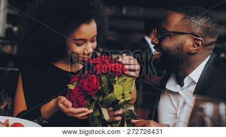 African American Couple Dating In Restaurant. Romantic Couple In Love Dating. Cutel Man And Girl In 