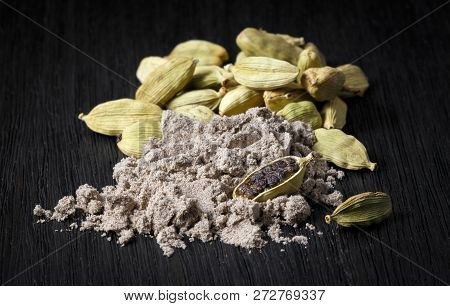 Spices; Cardamom Pods And Ground Coffee On A Dark Background