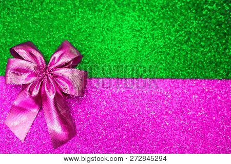 Plastic Pink Atlas Bow On The And Ufo Green And Purple Trend Colorful Sparcling Background. Fashion 