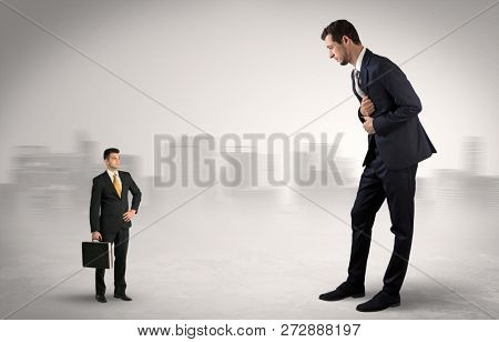 Giant businessman being afraid of small serious executor with suitcase