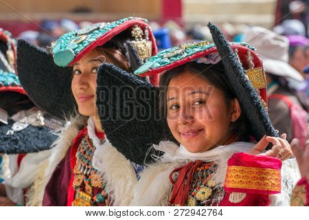 Lamayuru, India - June 19, 2017: Unidentified Zanskari women wearing ethnic costumes and traditional Ladakhi headdress with turquoise stones called Perakh Perak during Buddhist festival