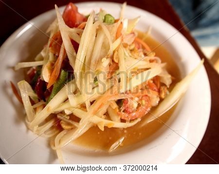 Som Tum Or Spicy Papaya Salad On The Table