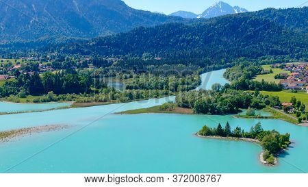 Aerial View Over Lake Forggensee At The City Of Fuessen In Bavaria Germany