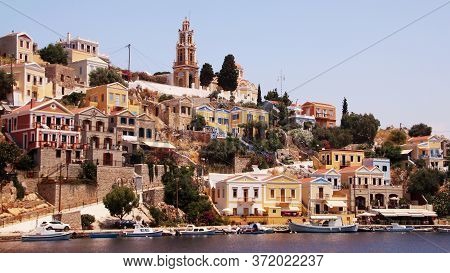 Symi, Greece - June 05, 2020: Symi Town, Symi Island, Pictorial View Of Colorful Houses And The Harb